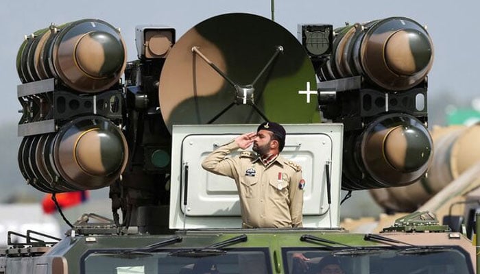 Pakistani Army soldier salutes while standing on an air defence missile system during Pakistan Day military parade in Islamabad, Pakistan, March 23, 2022. — Reuters