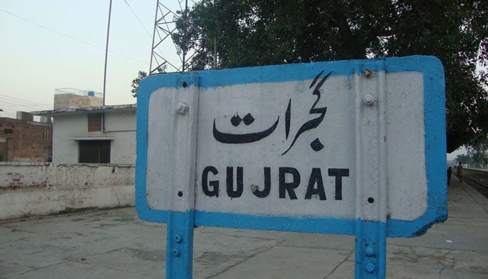 This representational image shows a signboard placed at Gujrat junction. — Facebook@gujratAdvertiseDotCom/File