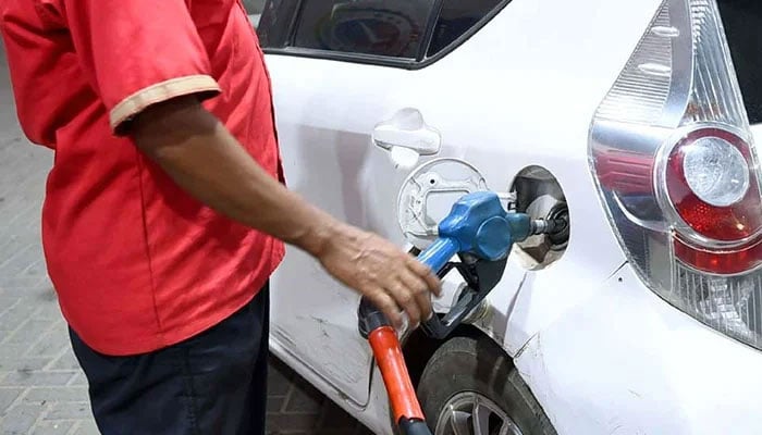 A fuel station worker fills petrol in a vehicle in Karachi on October 1, 2022. — PPI