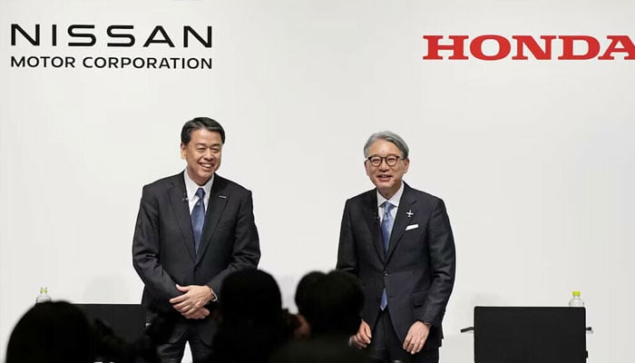 Makoto Uchida, president and CEO of Nissan Motor, and Toshihiro Mibe, Honda Motor president and CEO, attend their joint press conference in Tokyo, Japan March 15, 2024. — Reuters