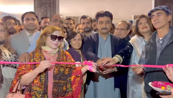 Sindh Culture and Tourism Syed Zulfiqar Ali Shah (centre) cuts a ribbon to inaugurate the Sheikh Ayaz Melo on December 20, 2024. — Screengrab via Facebook@MPAZulfiqarAliShah