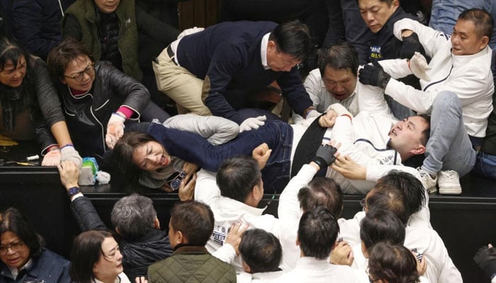 Taiwanese lawmakers tackle each other as President Lai Ching-tes party tries to block the passage of bills.— AFP/File