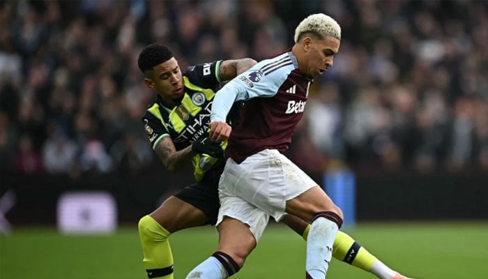 Aston Villas Morgan Rogers (right) vies with Manchester Citys Savinho during Saturday’s Premier League match in Birmingham, central England. — AFP/File