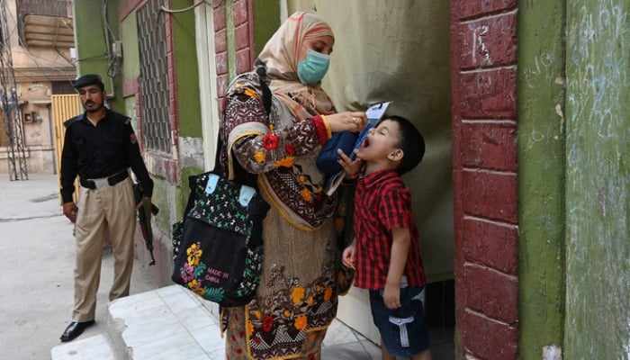 Representational image shows a health worker administering polio vaccine drops to a child during a vaccination campaign in Peshawar, on May 22, 2023. — AFP