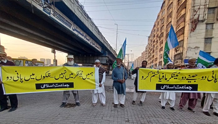 JI protestors hold banners in this image taken on December 21, 2024 in Karachi.— Facebook@Khijamaat