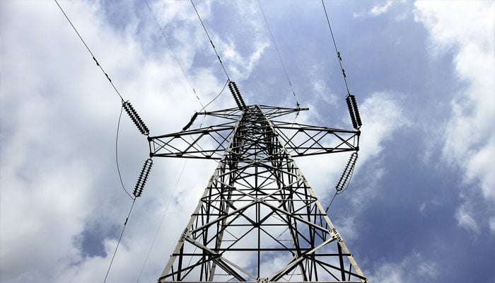 An electricity pylon along on April 9, 2014. — Reuters