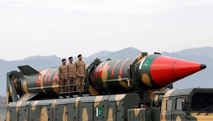 Military personnel stand beside a Shaheen III surface-to-surface ballistic missile during Pakistan Day military parade in Islamabad on March 23, 2019.— Reuters