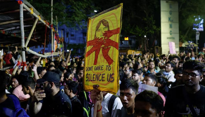 A medical student carries a placard, as he walks along with doctors and paramedics to join a protest against what they say is rape and murder of a trainee doctor, inside the premises of R G Kar Medical College and Hospital in Kolkata, India, August 12, 2024. — Reuters