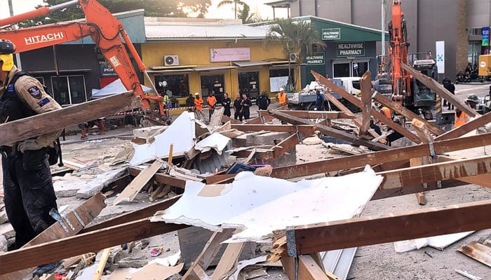 Australian rescue workers comb through the site of a collapsed building in Port Vila, the capital city of Vanuatu. —AFP/File