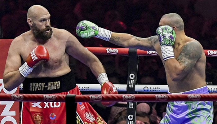 Ukraines Oleksandr Usyk (blue trunks) gets the measure of Britains Tyson Fury (red trunks) in Usyks unanimous decision victory in their heavyweight world title fight at the Kingdom Arena in Riyadh. — AFP/File