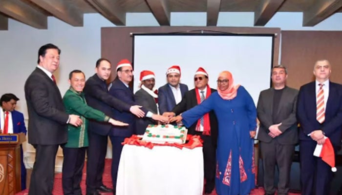 Foreign ambassadors cut a cake to celebrate the Christmas event organised by Chairman Pakistan Cultural Forum and Secretary General of UBG, Zafar Bakhtawari, along with UBG Central Core Committee Member (FPCCI) and former ICCI President Ahsan Zafar Bakhtawari on December 22, 2024. — Screengrab via Facebook@ahsanbakhtawariofficial