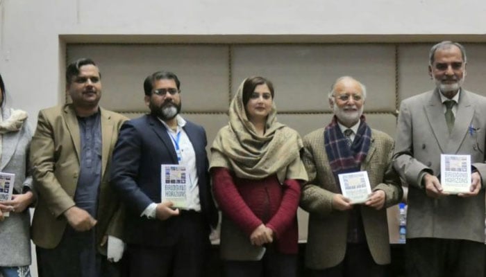 Participants pose for a photo during a book launching ceremony. — LinkedIn/Mughiza Imtiaz/File