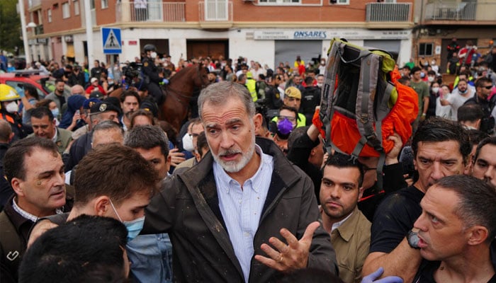 Spains King Felipe VI talking to people. — AFP/File