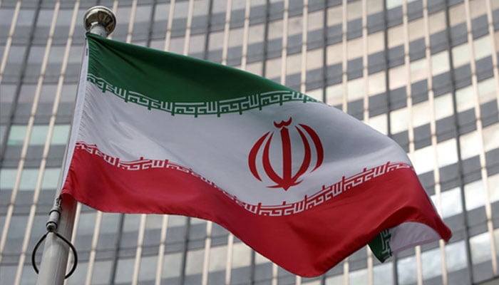 The Iranian flag flutters in front of the International Atomic Energy Agency (IAEA) headquarters in Vienna, Austria, June 5, 2023. — Reuters