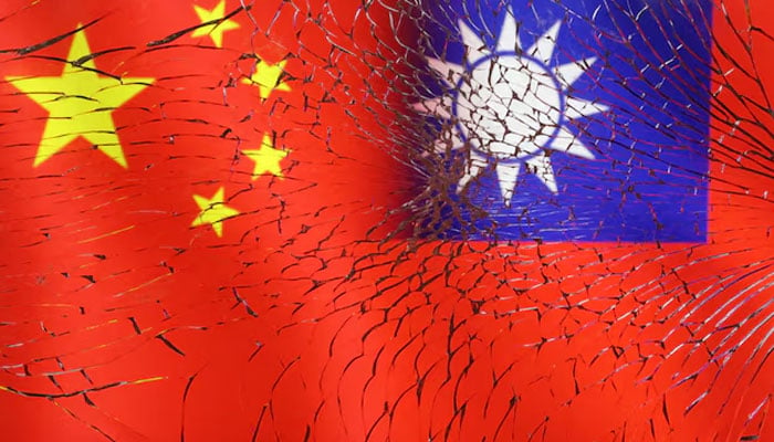 Chinese and Taiwanese flags are seen through broken glass in this illustration taken, April 11, 2023.— Reuters