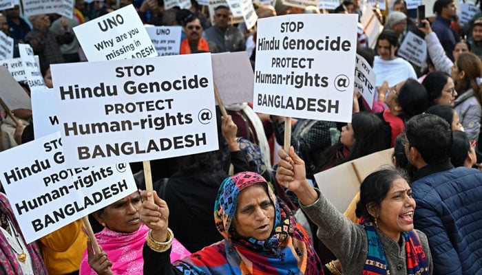 Hindu protestors holding placards during a protest at Dhaka. — AFP/File