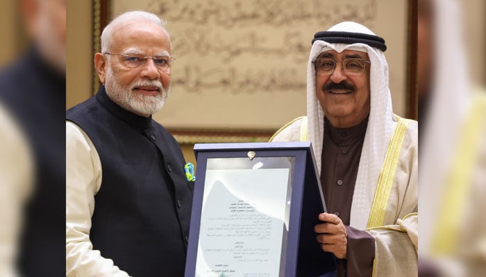 Prime Minister Narendra Modi being conferred with Kuwaits highest honour The Order of Mubarak Al Kabeer by Amir of Kuwait Sheikh Meshal Al-Ahmad Al-Jaber Al Sabah, in Kuwait on December 22, 2024.— X@narendramodi