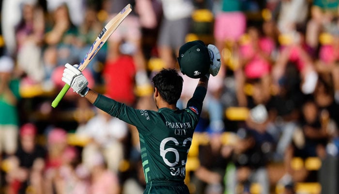 Pakistan´s Saim Ayub celebrates after scoring a century (100 runs) during the third one day international (ODI) cricket match batween South Africa and Pakistan at The Wanderers Stadium in Johannesburg on December 22, 2024.— AFP