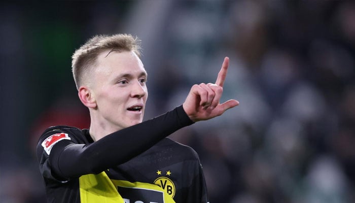 Dortmunds Maximilian Beier gestures number two as he celebrates scoring. —AFP/File