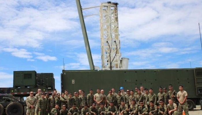 American and Filipino soldiers pose in front of the US Typhoon missile during an orientation on the operations of the said system. —Philippine Army/File