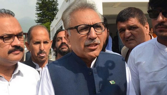 Former president and PTI leader Dr Arif Alvi speaks to media in Islamabad. — AFP/File