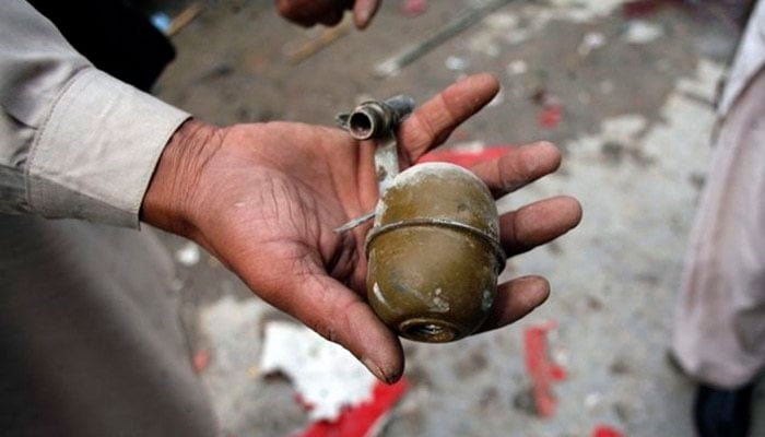 A man holding a hand grenade in this undated image. — Reuters/File