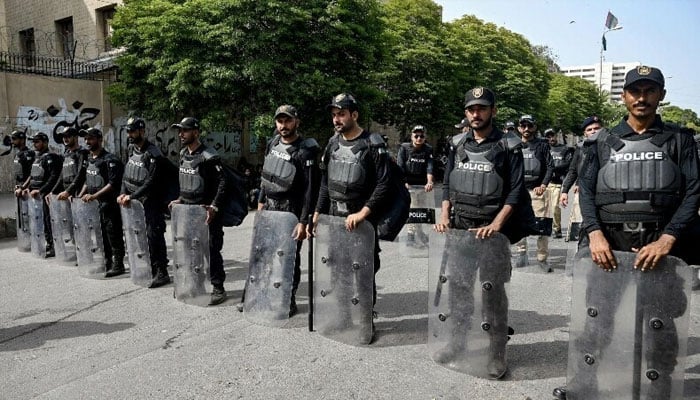 Representational image shows security personnel standing guard along a street. — AFP/File