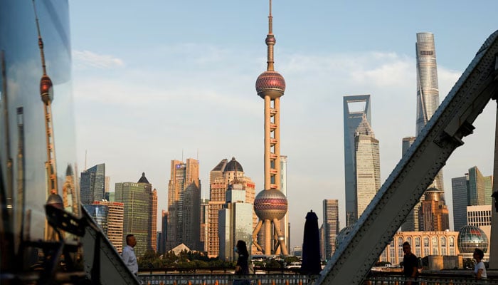 A view of the financial district of Pudong is reflected on a bus passing by, in Shanghai, China September 27, 2024.— Reuters