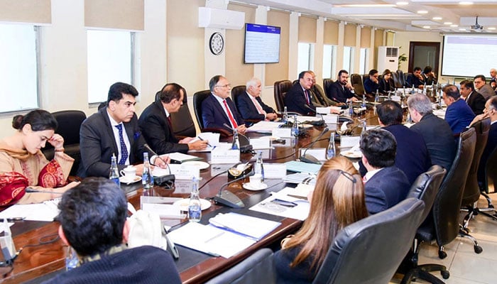 Federal Minister for Finance and Revenue, Senator Muhammad Aurangzeb, chairing the meeting of the Cabinet Committee on State-Owned Enterprises (CCoSOES) at the Finance Division, Islamabad on December 24,2024.— APP/File