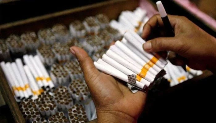 Cigarettes seen in a persons hand. — Reuters/file