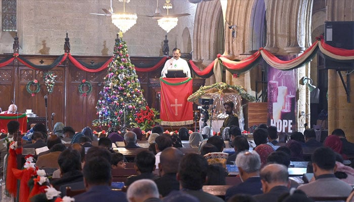 Members of Christian community offer Christmas prayers at a church. — APP/File