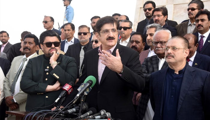 Sindh Chief Minister Syed Murad Ali Shah (centre) and Governor Mohammad Kamran Tessori (left) address the media at Mazar-e-Quaid after paying homage to the Father of the Nation on his birth anniversary December 25th, 2024. — Facebook@SindhCMHouse