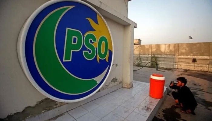 A man drinks water from a cooler at a Pakistan State Oil petrol station in Peshawar, on October 2, 2017. —Reuters