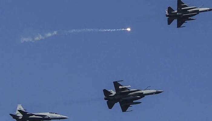 Pakistans Air Force fighter JF-17 fighter jets fly past during the multinational naval exercise AMAN-23 in the Arabian Sea near Pakistans port city of Karachi on February 13, 2023. — AFP