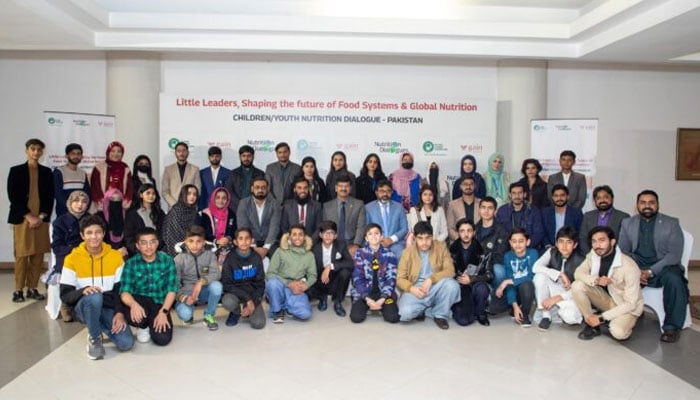 The image shows a group photo on the occasion of “Little Leaders, Big Impact – Children/Youth Nutrition Dialogue held by the Global Alliance for Improved Nutrition and National Alliance for Safe Food on Dec 27, 2024. — APP/File