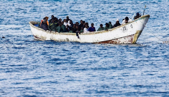 A Spanish Coast Guard vessel tows a fibreglass boat with migrants onboard to the port of Arguineguin, on the island of Gran Canaria, Spain, on December 25 2024. — Reuters