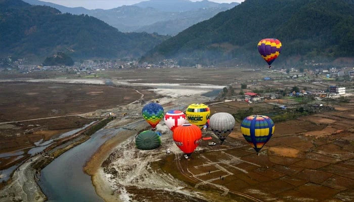 Hot air balloons rise in the sky during the International Hot-Air Balloon festival in Pokhara. —AFP/File