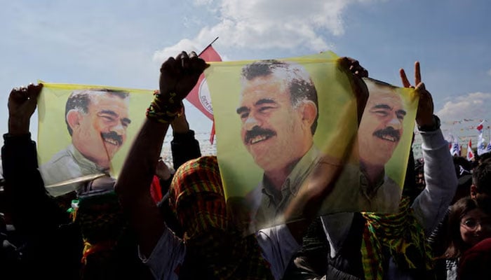 Supporters of the pro-Kurdish Peoples Equality and Democracy Party (DEM Party) display flags with a portrait of jailed Kurdistan Workers Party (PKK) leader Abdullah Ocalan, in Istanbul, Turkey, March 17, 2024. — Reuters