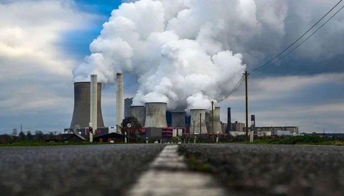 Smoke rises from the cooling towers of the power station on November 28, 2023. — AFP