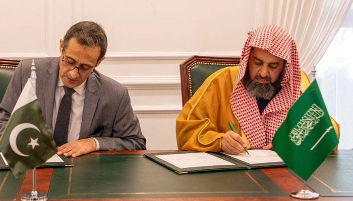 Saudi Ministry of Islamic Affairs, Dawah and Guidance Sheikh Dr. Awad bin Sabti Al-Anazi(left) signs an MoU with Pakistans Ministry of Religious Affairs Zulfiquar Haider on December 28, 2024. — Facebook@mora.official