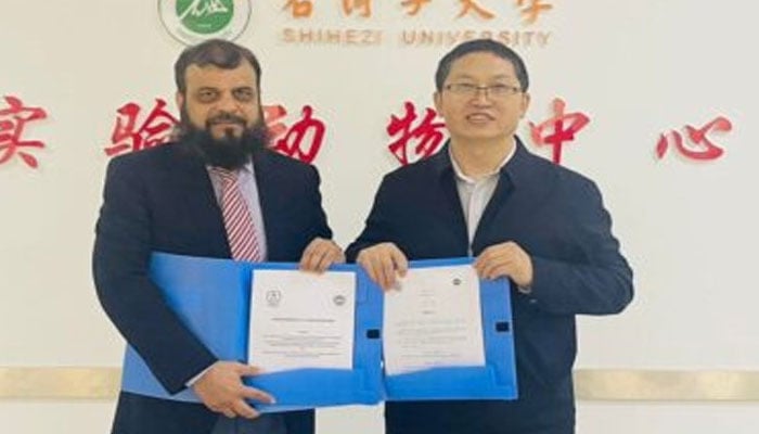 A photo from teh MoU signing ceremony between School of Medicine, Shihezi University, China, and the Centre of Excellence in Molecular Biology (CEMB), University of the Punjab, Lahore.— Facebook@apponfb/File