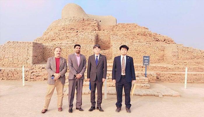 Two Japanese tourists with two locals seen in this image.— sindhculture.gov.pk/File