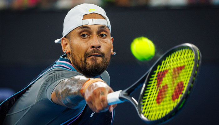 Australia’s Nick Kyrgios hits a return against France’s Giovanni Mpetshi Perricard. —AFP/File