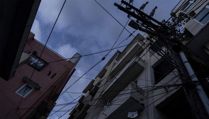 Power and communication lines are seen on a dark street in San Juan, Puerto Rico after a major power outage hit the island on December 31, 2024. — AFP