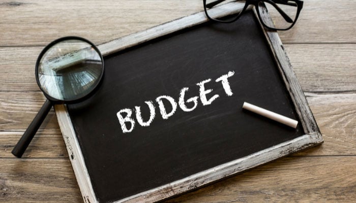 A representational image of budget written with chalk on a miniature black board. — Canva/File