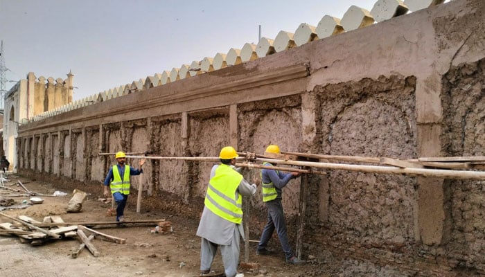 WCLA workers seen doing restoration work at the Shahi Qila, Lahore.— Facebook@shalimargardensofficial/file