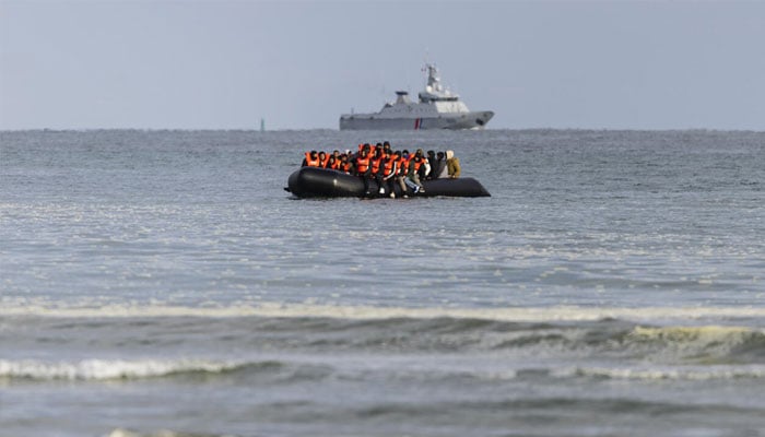 Migrants on flimsy boat in  journey across the Channel . — AFP/File