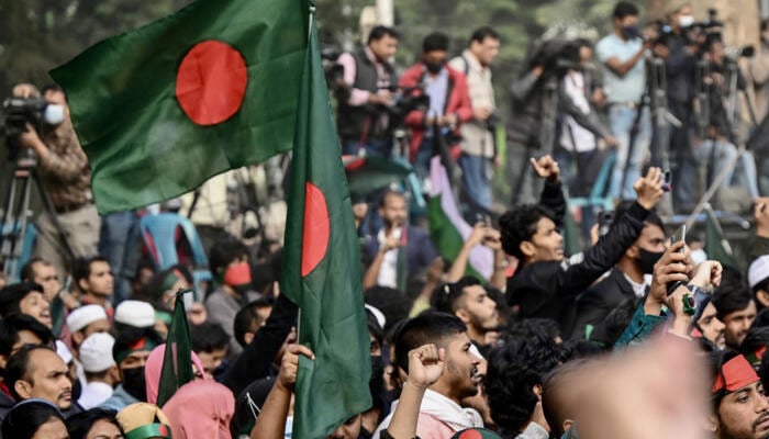 Students and supporters shout slogans during a March for Unity organised by the Anti-Discrimination Student Movement in Dhaka on New Years eve. —AFP/File