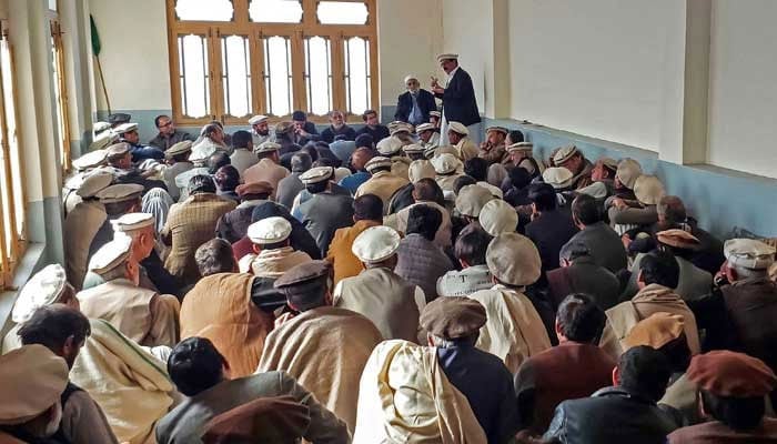 A large number of people are seen gathered during a meeting at a mosque in Parachinars Kurram District on December 3, 2024. — AFP