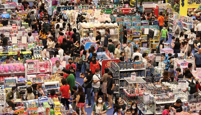 Shoppers browse merchandise in a shopping mall on Orchard Road, in Singapore December 23, 2022. — Reuters